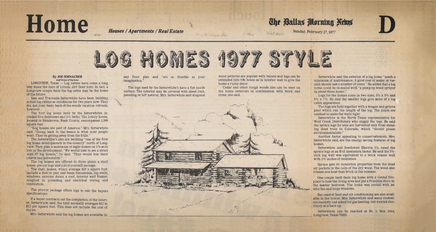 The image features a newspaper prominently displaying a sketched illustration of a beautiful log home.
